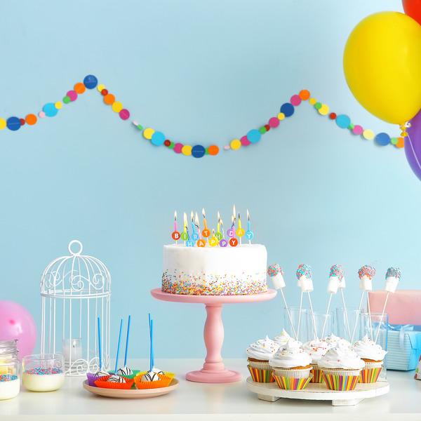 Tasty candy bar for Birthday party on table against color backgr